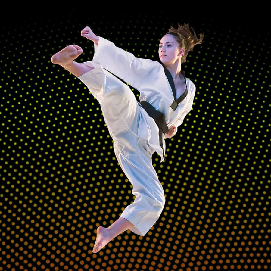 Martial Arts Lessons for Adults in Bolingbrook IL - Girl Black Belt Jumping High Kick
