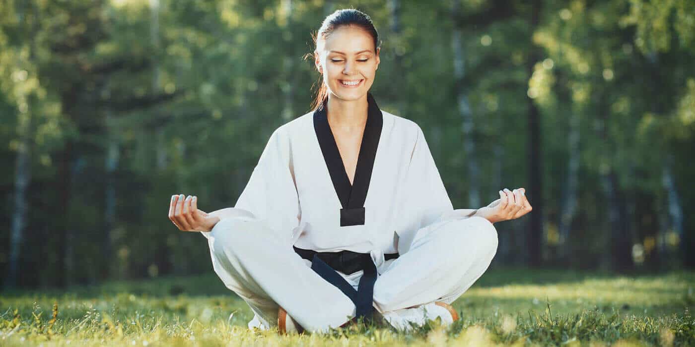 Martial Arts Lessons for Adults in Bolingbrook IL - Happy Woman Meditated Sitting Background